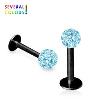 Musta huulikoru kristallipallolla